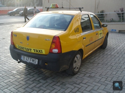 Sárga Dacia Logan 1.4 MPI taxi Bukarestben